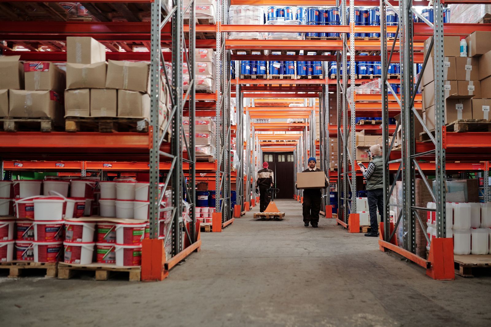 Sealed storage vaults racked inside a warehouse